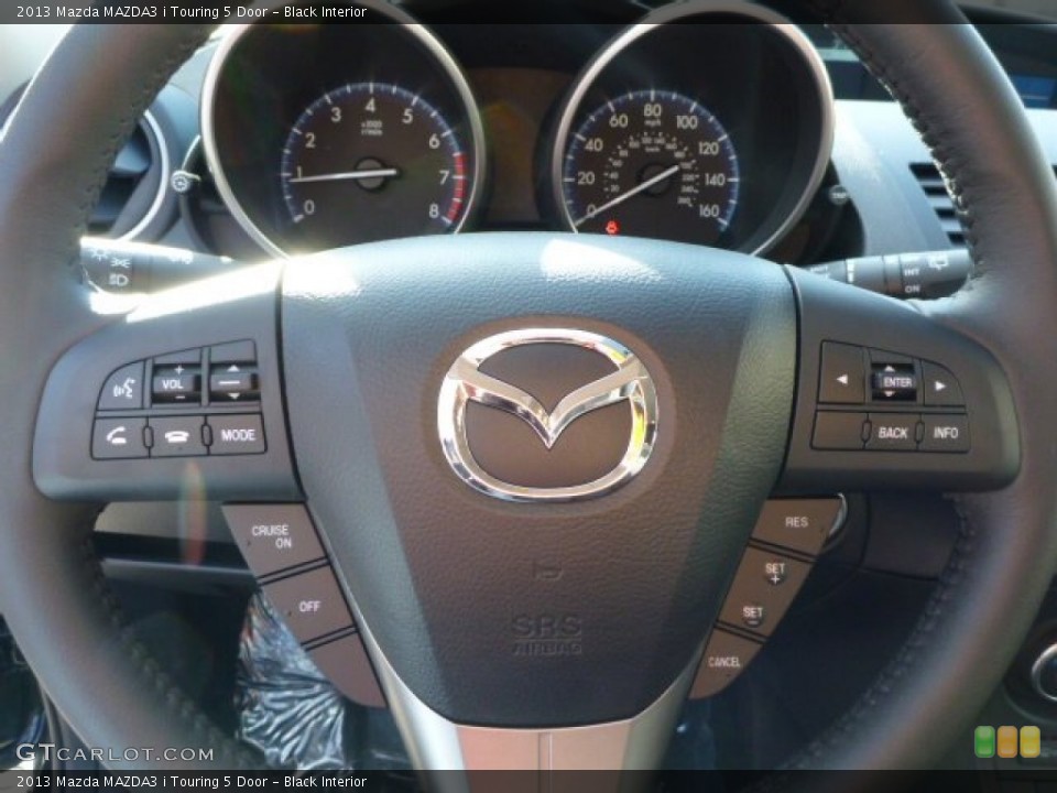 Black Interior Steering Wheel for the 2013 Mazda MAZDA3 i Touring 5 Door #77143049