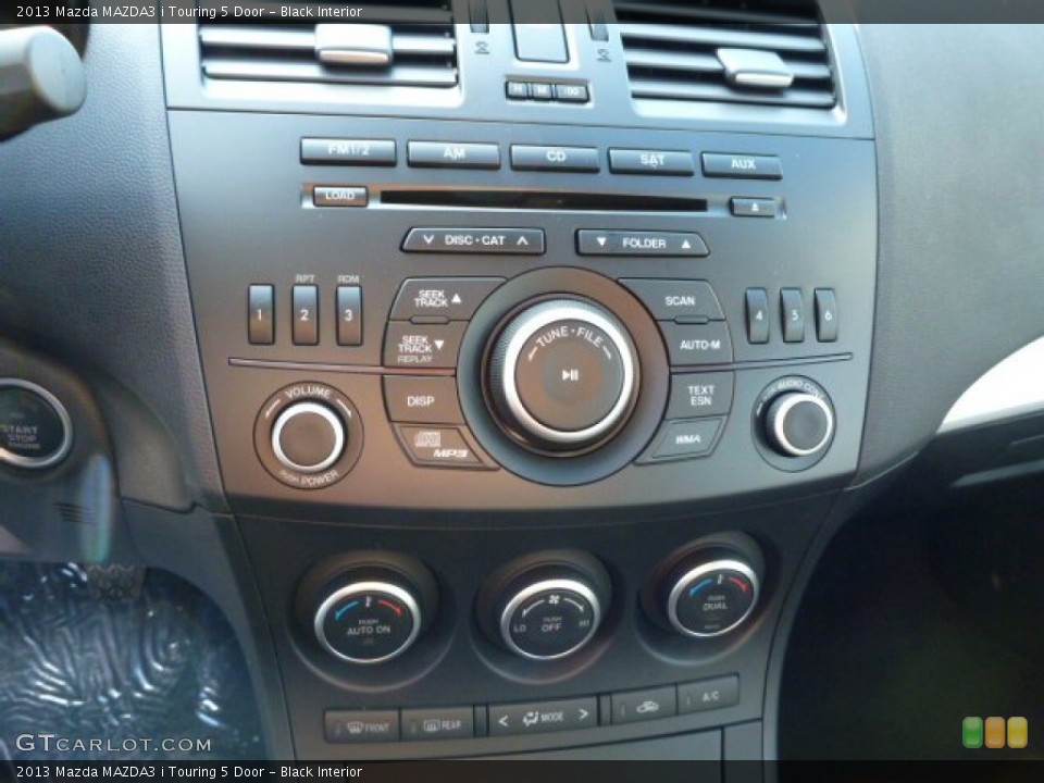 Black Interior Controls for the 2013 Mazda MAZDA3 i Touring 5 Door #77143067
