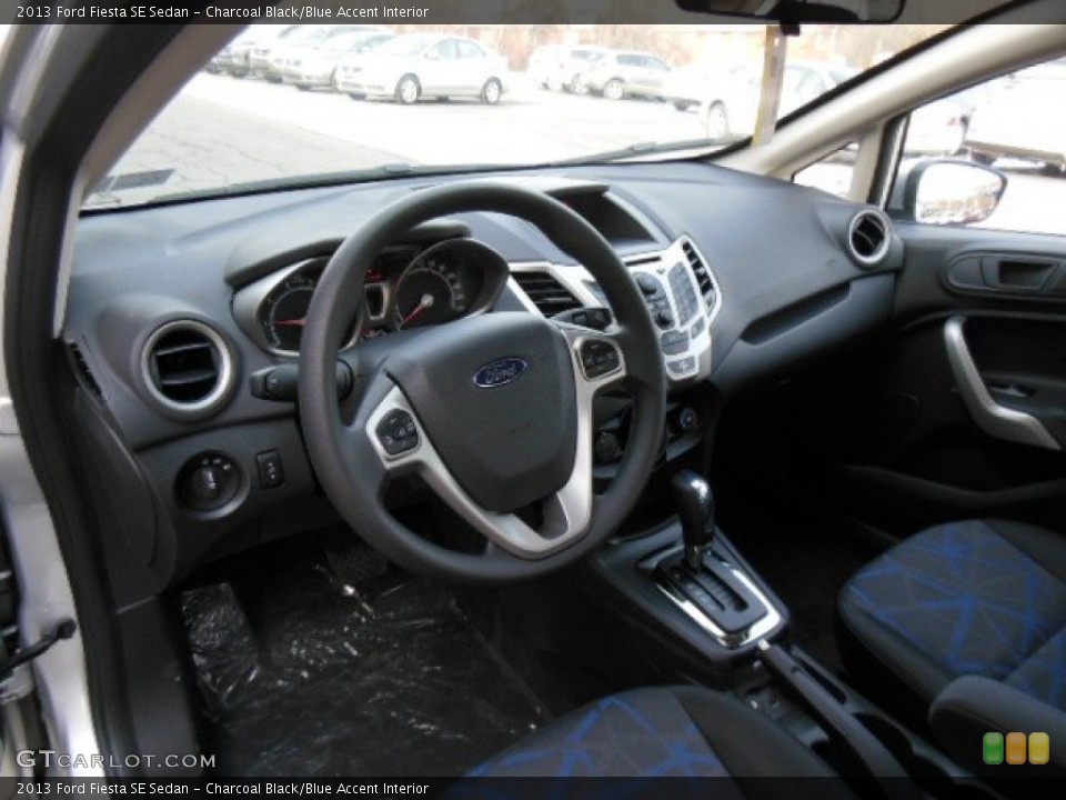 Charcoal Black/Blue Accent Interior Prime Interior for the 2013 Ford Fiesta SE Sedan #77400035