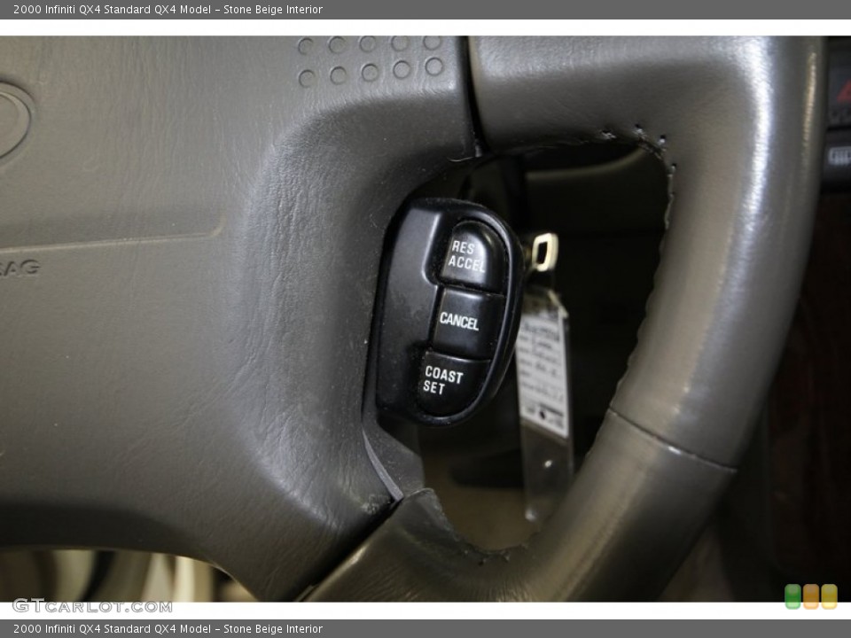 Stone Beige Interior Controls for the 2000 Infiniti QX4  #77406228