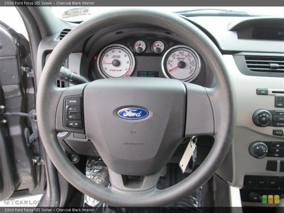 Charcoal Black Interior Steering Wheel for the 2009 Ford Focus SES Sedan #77435468