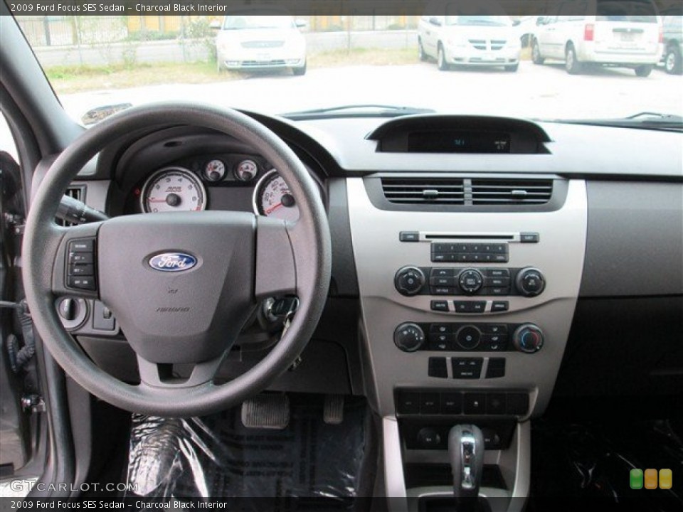 Charcoal Black Interior Dashboard for the 2009 Ford Focus SES Sedan #77435484