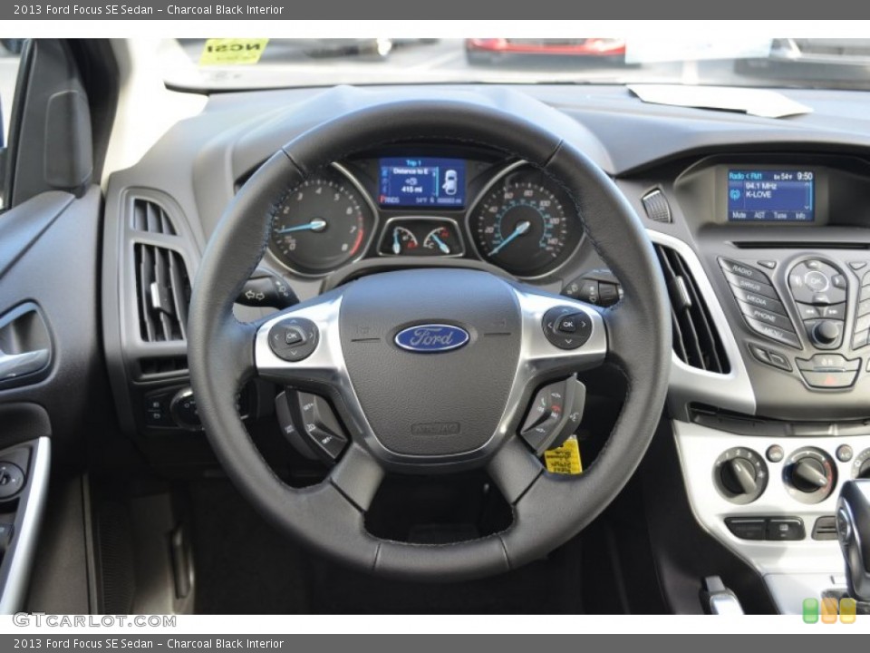 Charcoal Black Interior Steering Wheel for the 2013 Ford Focus SE Sedan #77457576