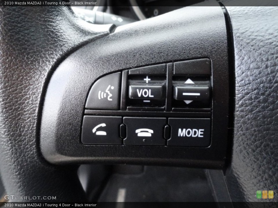 Black Interior Controls for the 2010 Mazda MAZDA3 i Touring 4 Door #77480171
