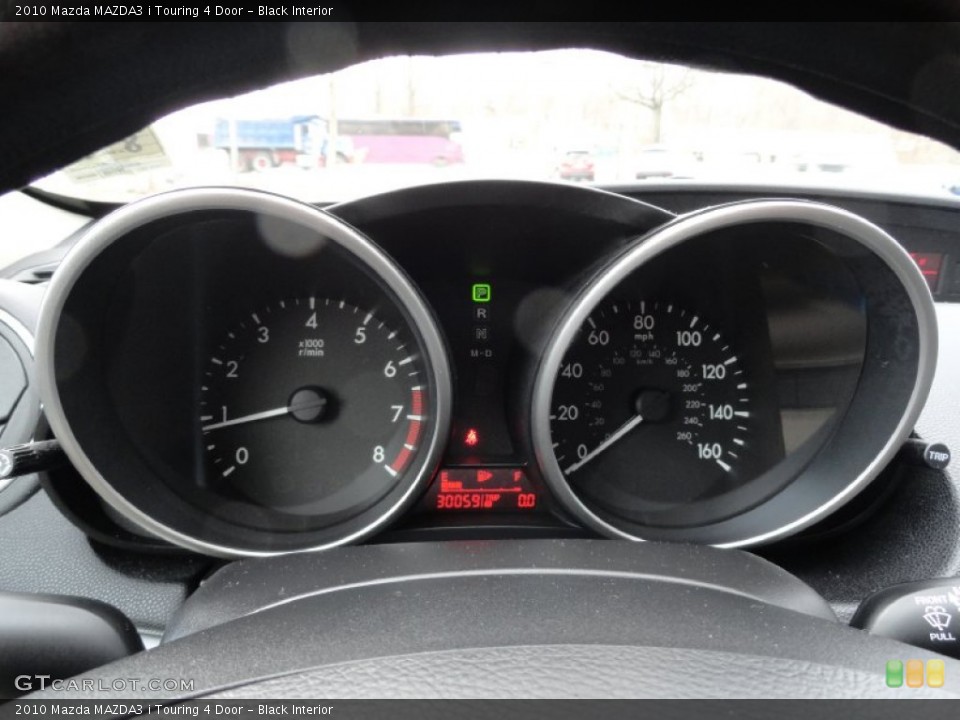 Black Interior Gauges for the 2010 Mazda MAZDA3 i Touring 4 Door #77480217