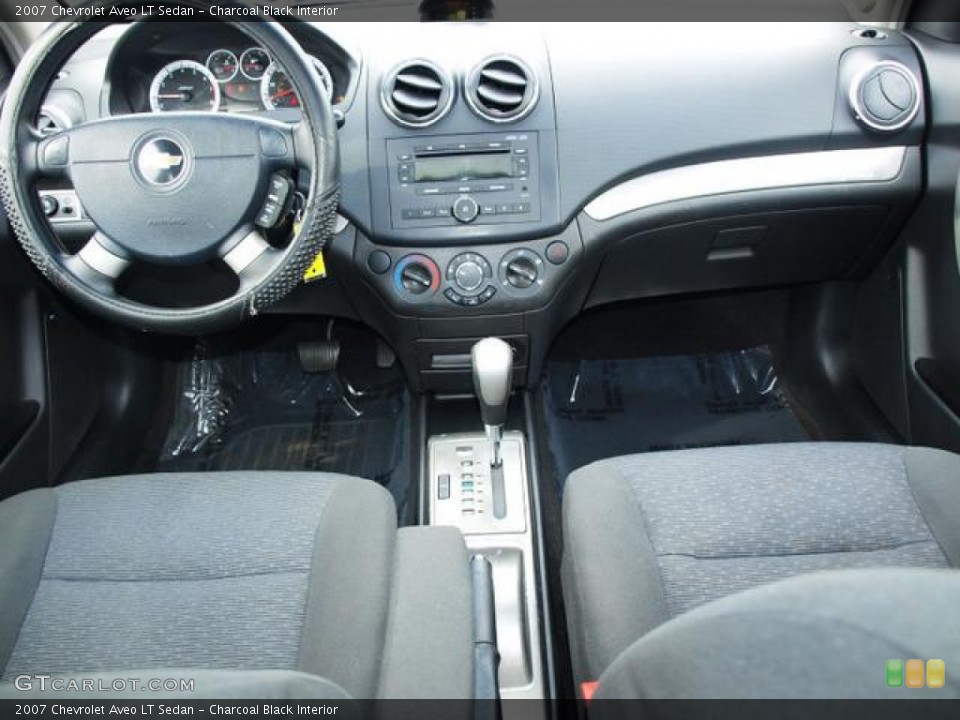 Charcoal Black Interior Dashboard for the 2007 Chevrolet Aveo LT Sedan #77494916