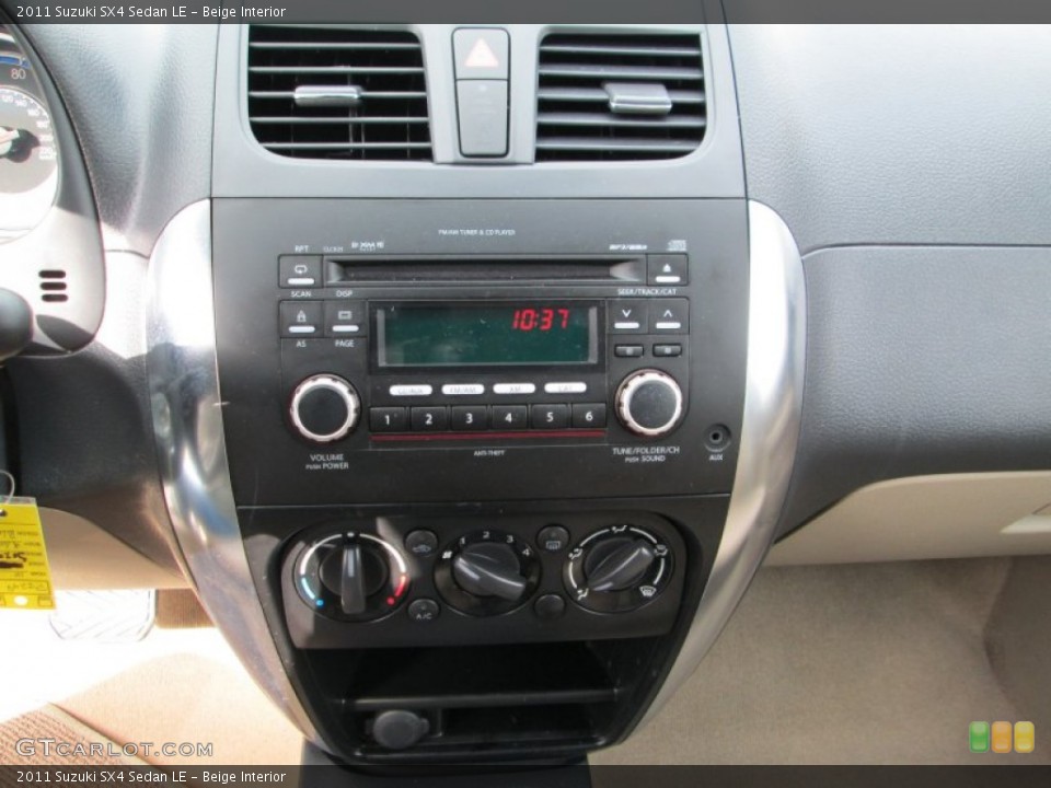 Beige Interior Controls for the 2011 Suzuki SX4 Sedan LE #77532710