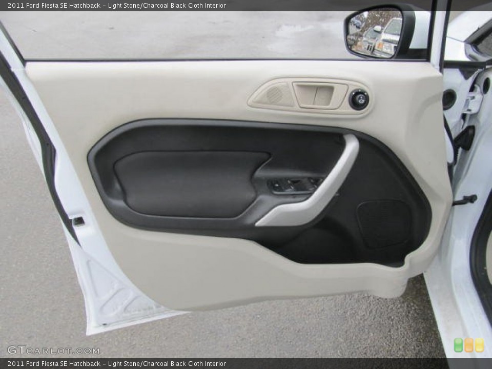 Light Stone/Charcoal Black Cloth Interior Door Panel for the 2011 Ford Fiesta SE Hatchback #77605119