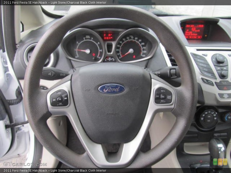 Light Stone/Charcoal Black Cloth Interior Steering Wheel for the 2011 Ford Fiesta SE Hatchback #77605165