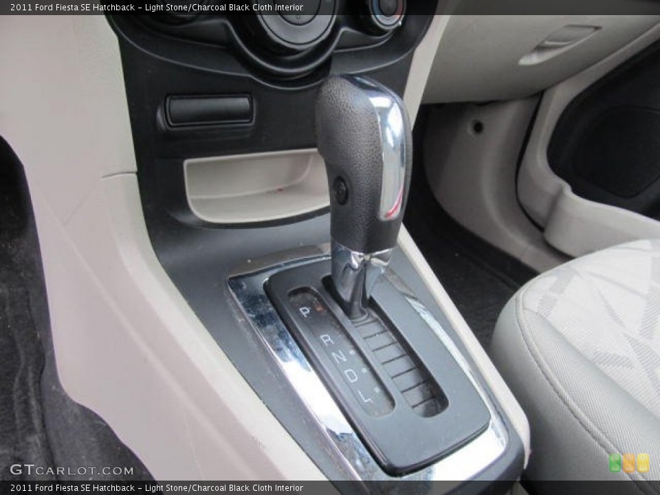 Light Stone/Charcoal Black Cloth Interior Transmission for the 2011 Ford Fiesta SE Hatchback #77605194