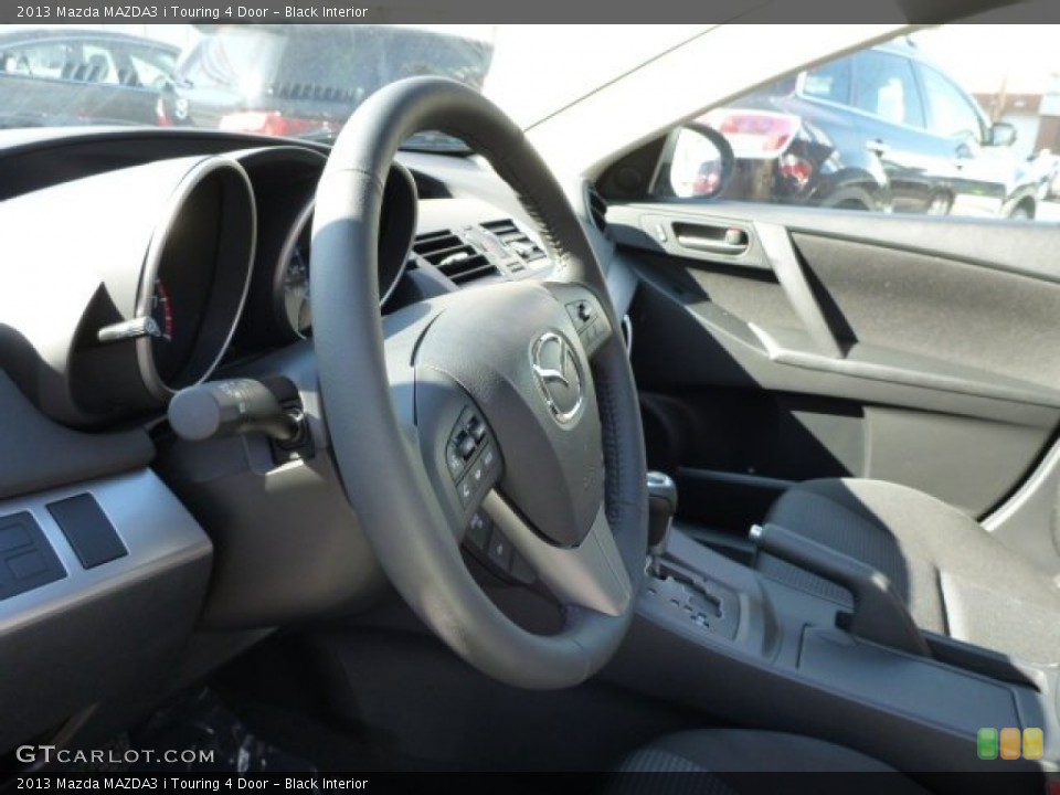 Black Interior Steering Wheel for the 2013 Mazda MAZDA3 i Touring 4 Door #77720761