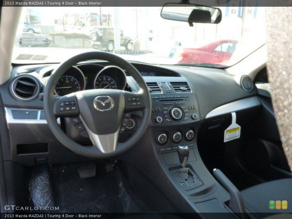 Black Interior Dashboard for the 2013 Mazda MAZDA3 i Touring 4 Door #77721051