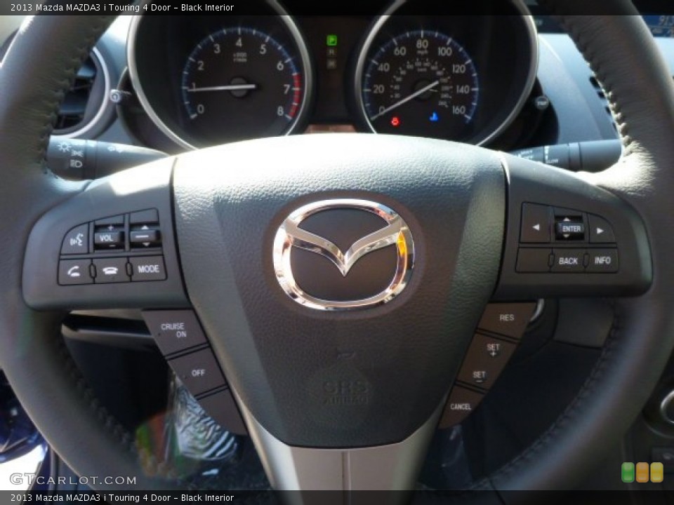 Black Interior Controls for the 2013 Mazda MAZDA3 i Touring 4 Door #77721117