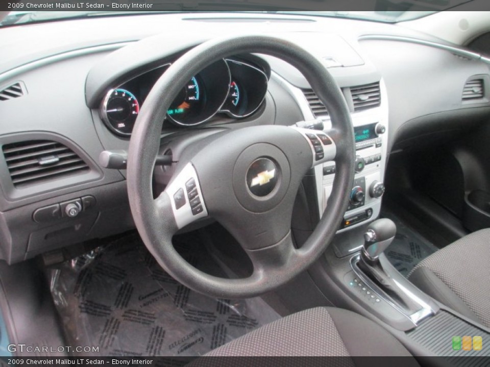 Ebony Interior Dashboard for the 2009 Chevrolet Malibu LT Sedan #77747625