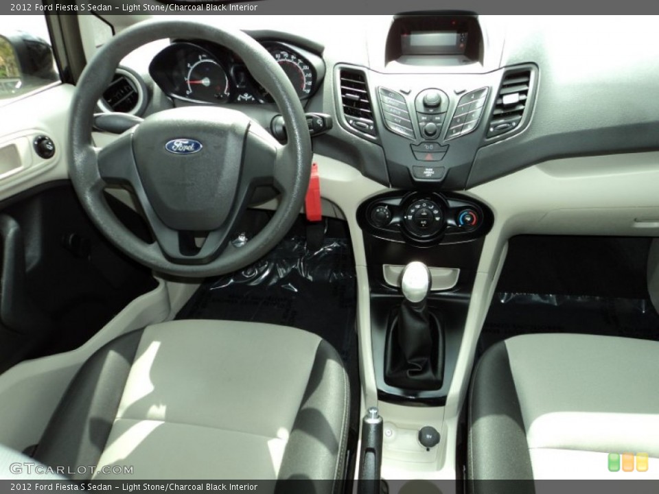 Light Stone/Charcoal Black Interior Dashboard for the 2012 Ford Fiesta S Sedan #77757504