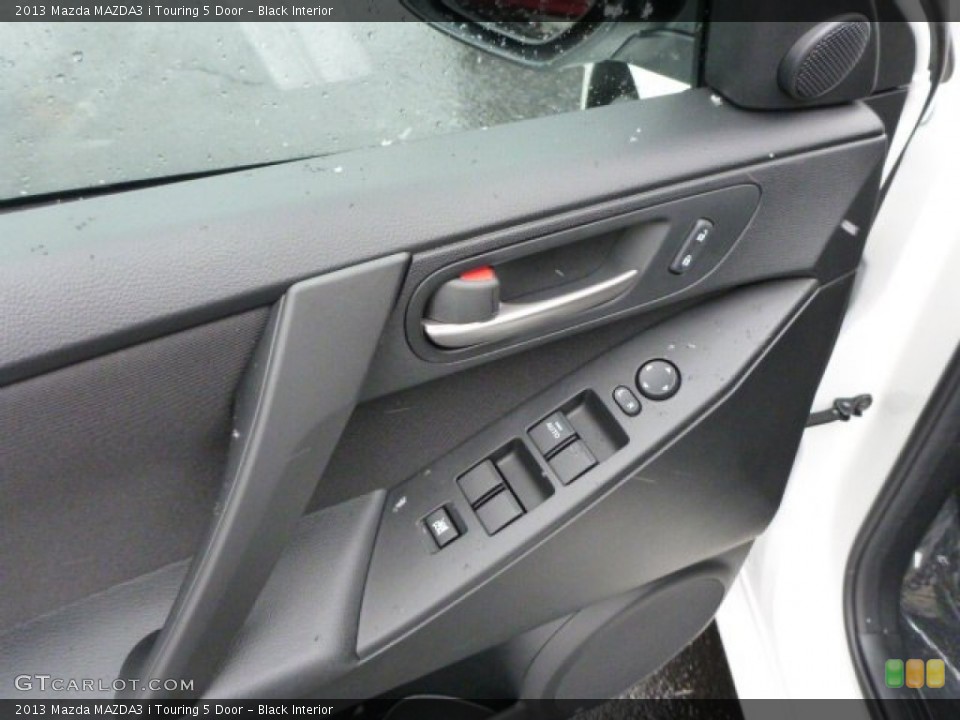 Black Interior Controls for the 2013 Mazda MAZDA3 i Touring 5 Door #77813601