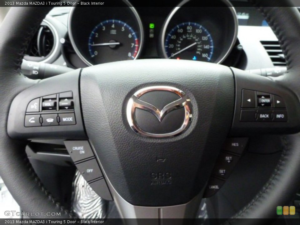 Black Interior Steering Wheel for the 2013 Mazda MAZDA3 i Touring 5 Door #77813661