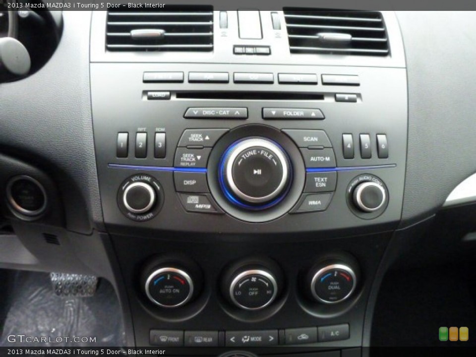 Black Interior Controls for the 2013 Mazda MAZDA3 i Touring 5 Door #77813672