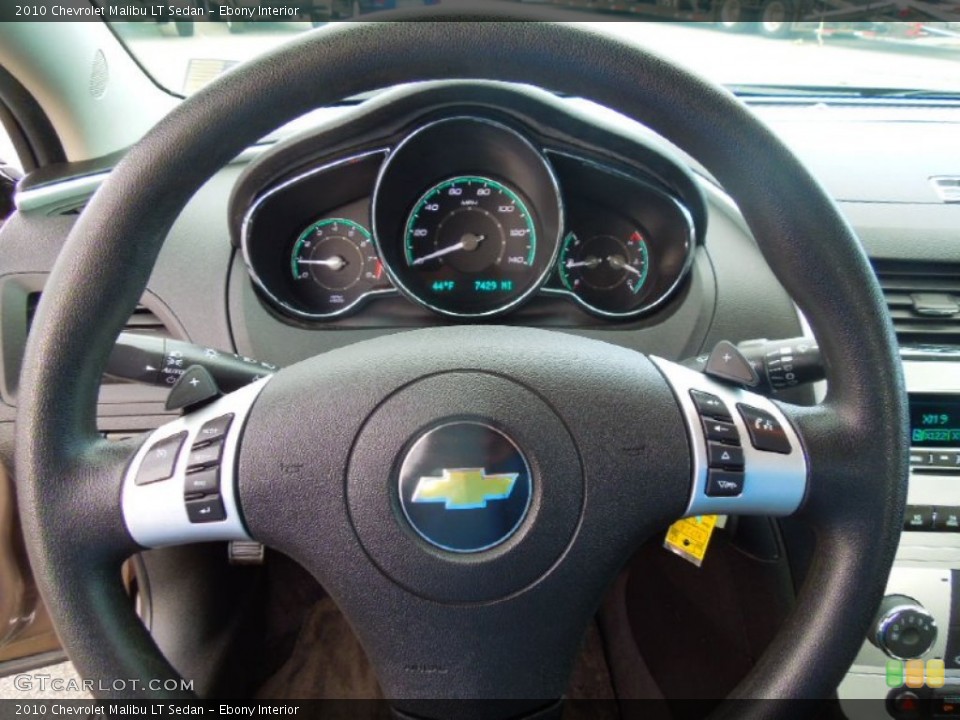 Ebony Interior Steering Wheel for the 2010 Chevrolet Malibu LT Sedan #77818715