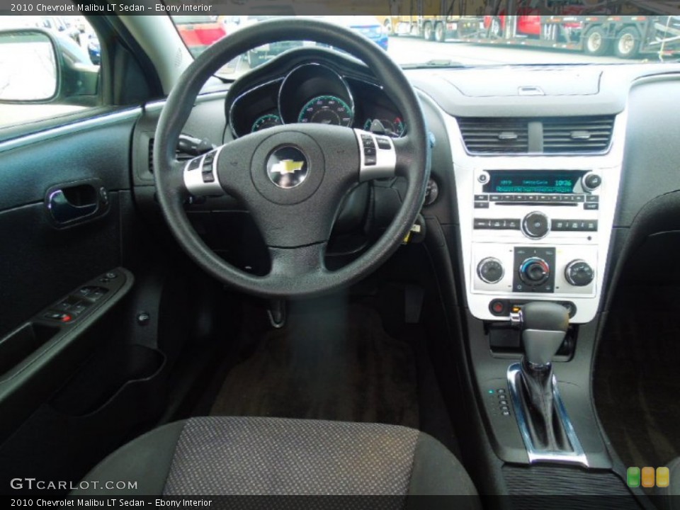 Ebony Interior Dashboard for the 2010 Chevrolet Malibu LT Sedan #77818724