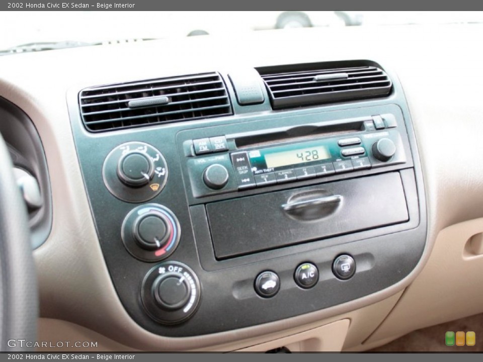 Beige Interior Controls for the 2002 Honda Civic EX Sedan #77899097