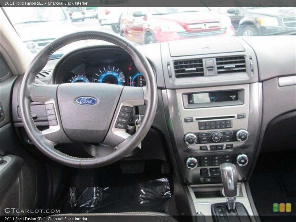 Charcoal Black Interior Dashboard for the 2011 Ford Fusion SEL #77909083