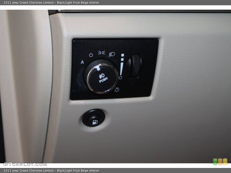 Black/Light Frost Beige Interior Controls for the 2011 Jeep Grand Cherokee Limited #78024348