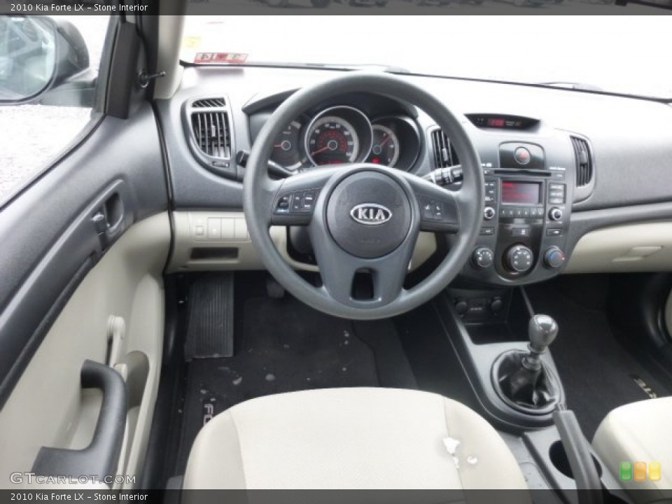 Stone Interior Dashboard for the 2010 Kia Forte LX #78080774