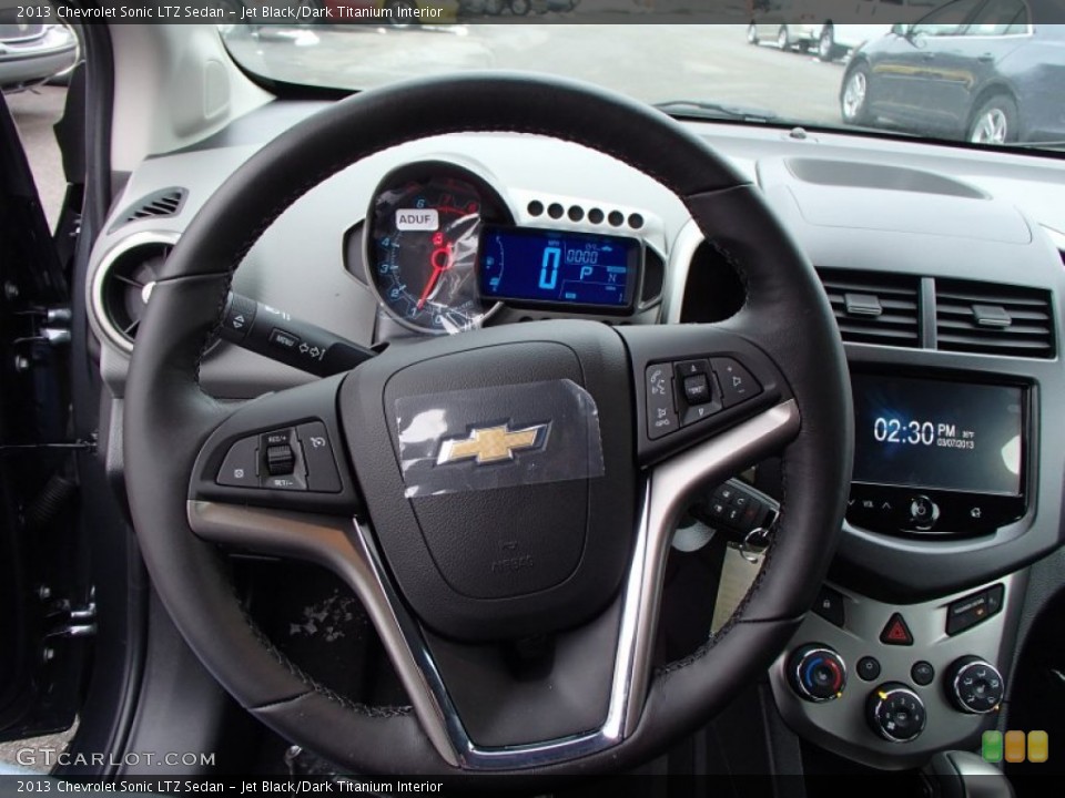 Jet Black/Dark Titanium Interior Steering Wheel for the 2013 Chevrolet Sonic LTZ Sedan #78120896