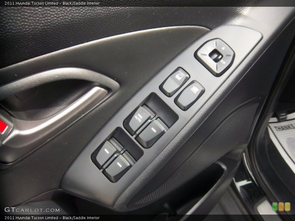 Black/Saddle Interior Controls for the 2011 Hyundai Tucson Limited #78166611