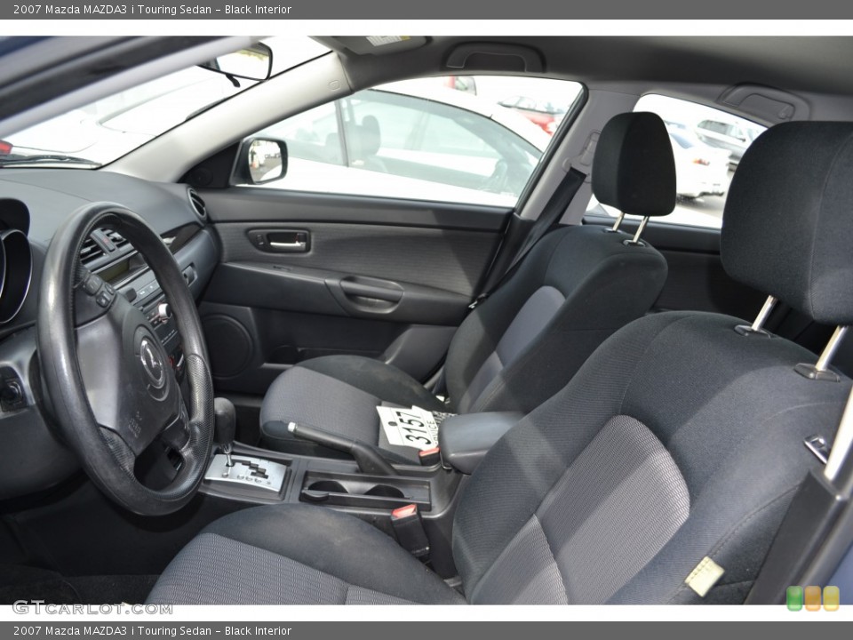 Black Interior Front Seat for the 2007 Mazda MAZDA3 i Touring Sedan #78207666