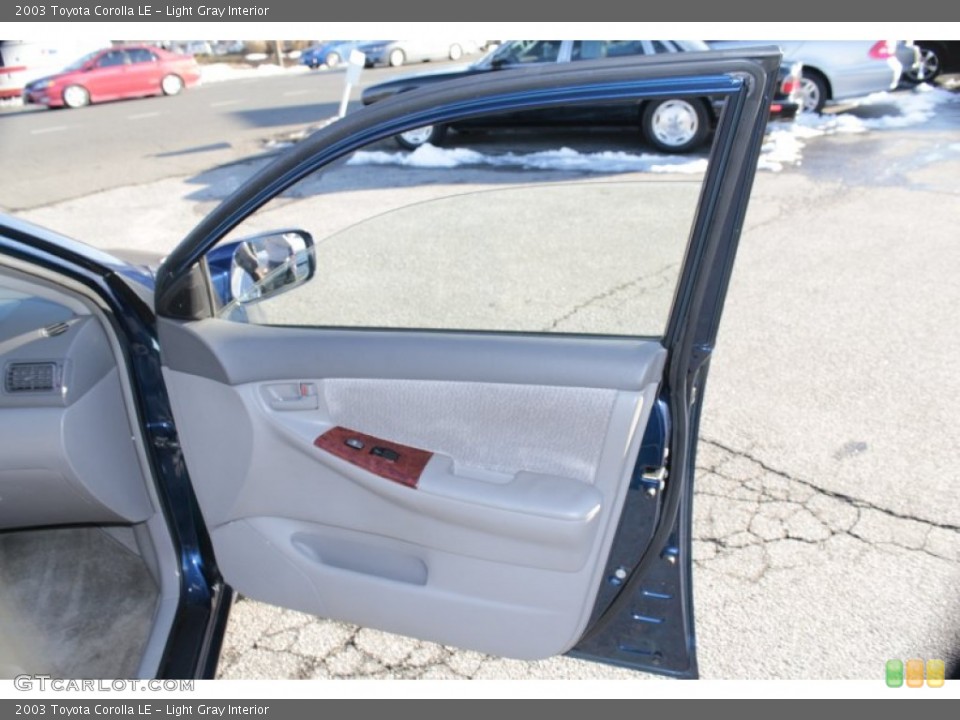 Light Gray Interior Door Panel for the 2003 Toyota Corolla LE #78218077