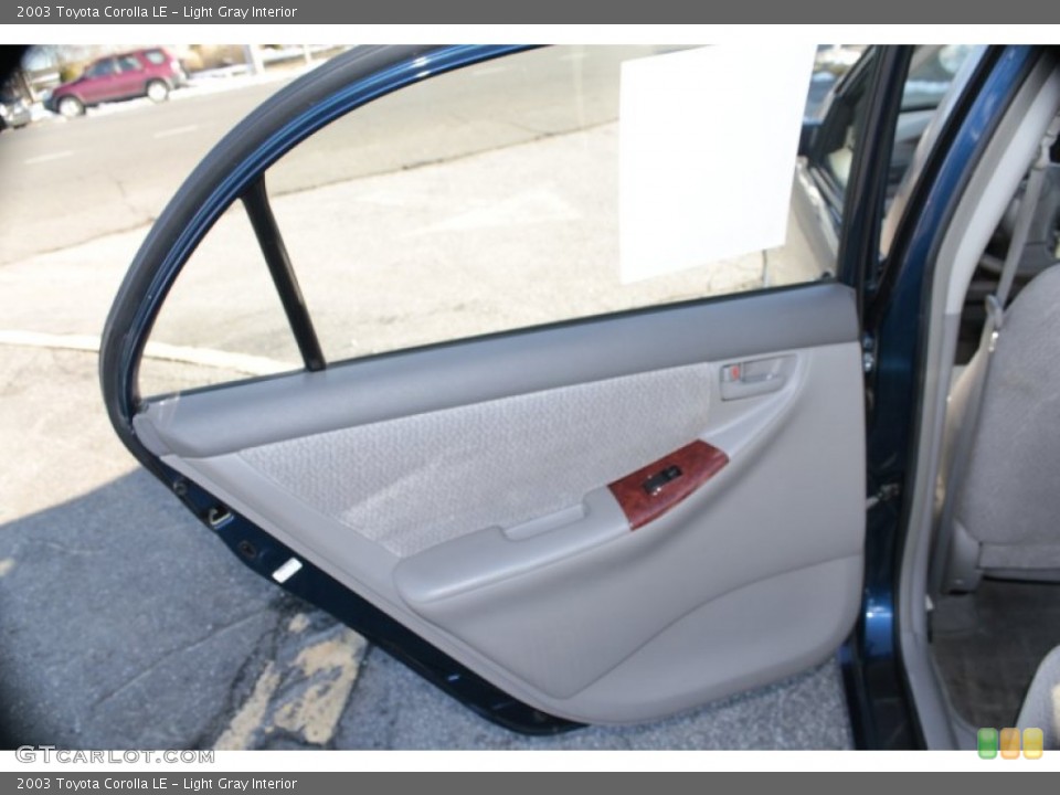Light Gray Interior Door Panel For The 2003 Toyota Corolla