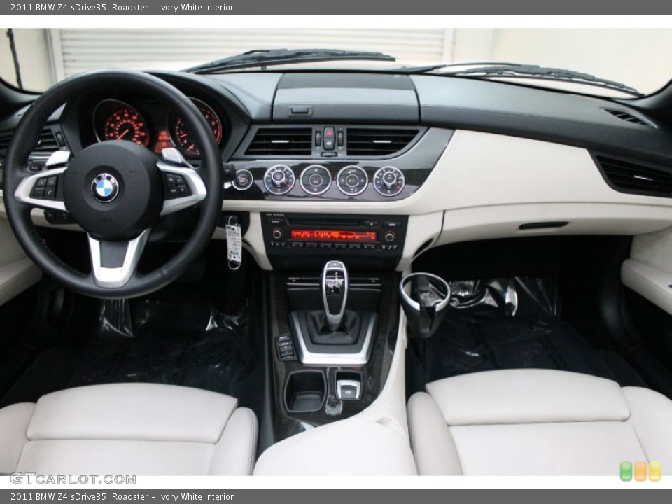 Ivory White Interior Dashboard for the 2011 BMW Z4 sDrive35i Roadster #78285814