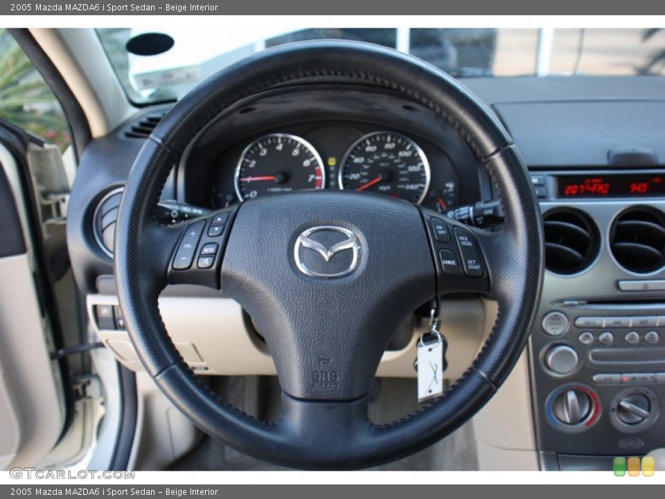 Beige Interior Steering Wheel for the 2005 Mazda MAZDA6 i Sport Sedan #78294289