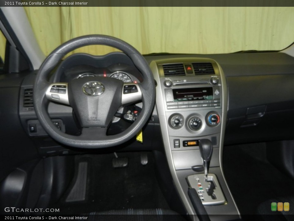 Dark Charcoal Interior Dashboard for the 2011 Toyota Corolla S #78313063