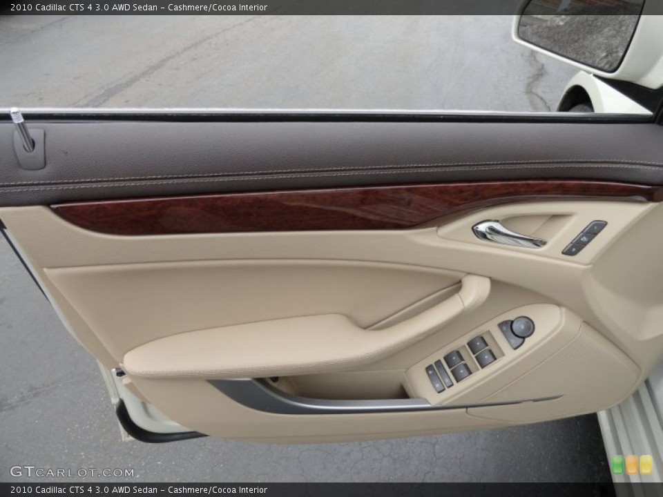 Cashmere/Cocoa Interior Door Panel for the 2010 Cadillac CTS 4 3.0 AWD Sedan #78389912
