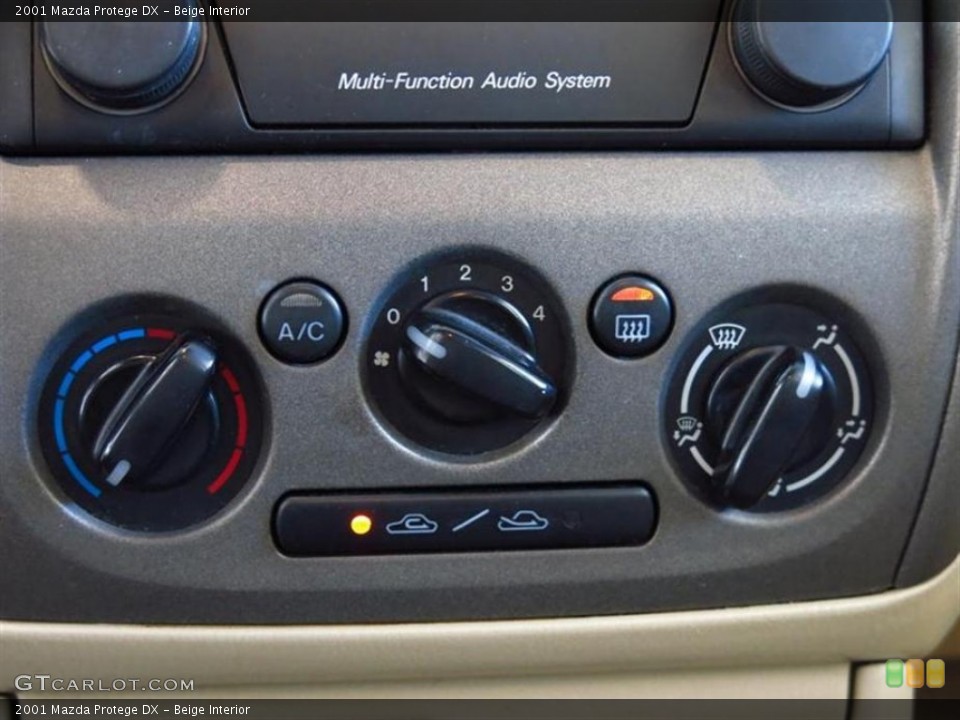 Beige Interior Controls for the 2001 Mazda Protege DX #78466956