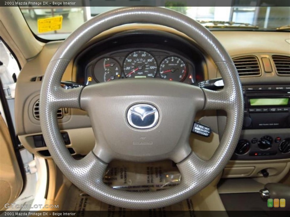 Beige Interior Steering Wheel for the 2001 Mazda Protege DX #78467062