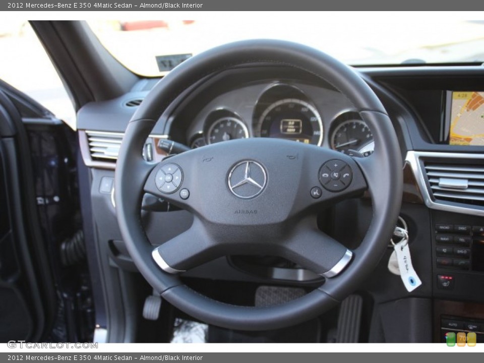 Almond/Black Interior Steering Wheel for the 2012 Mercedes-Benz E 350 4Matic Sedan #78486017