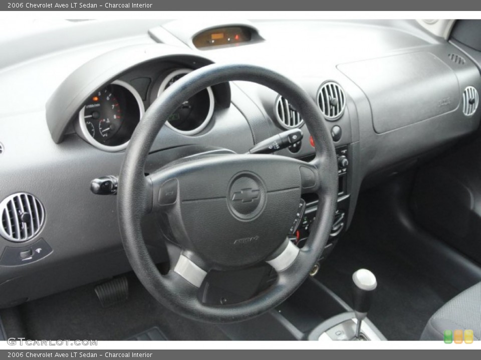 Charcoal Interior Dashboard for the 2006 Chevrolet Aveo LT Sedan #78579440
