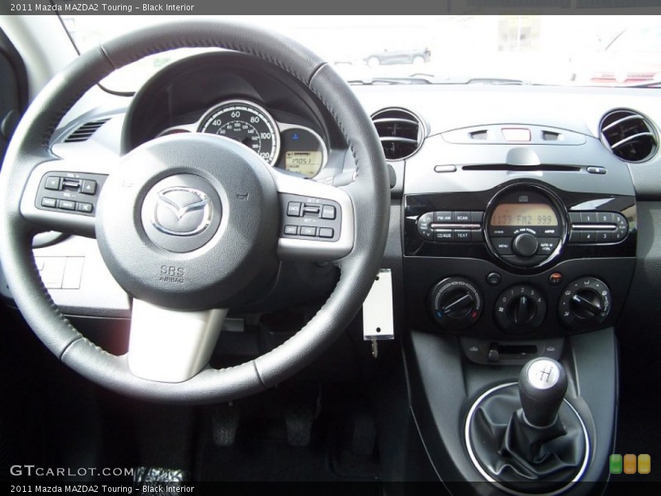 Black Interior Dashboard for the 2011 Mazda MAZDA2 Touring #78586459