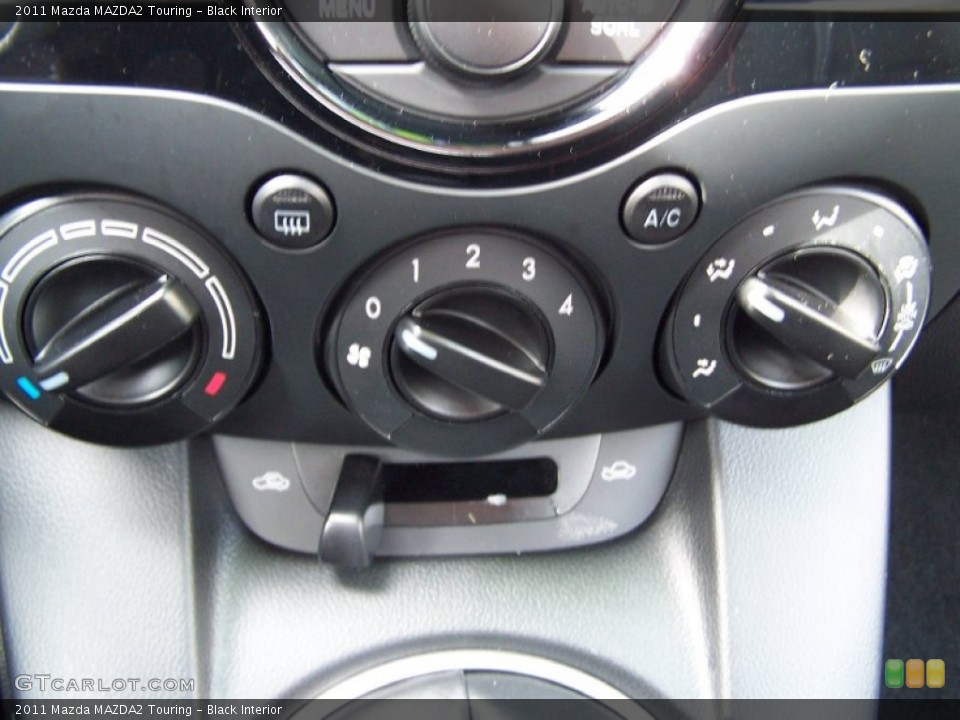 Black Interior Controls for the 2011 Mazda MAZDA2 Touring #78586526