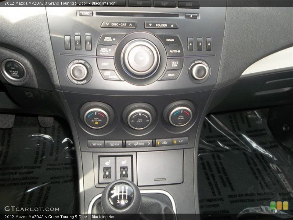 Black Interior Controls for the 2012 Mazda MAZDA3 s Grand Touring 5 Door #78733988