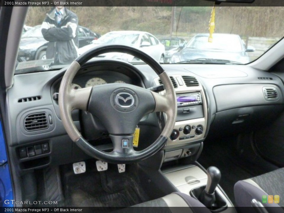Off Black Interior Dashboard for the 2001 Mazda Protege MP3 #78783330