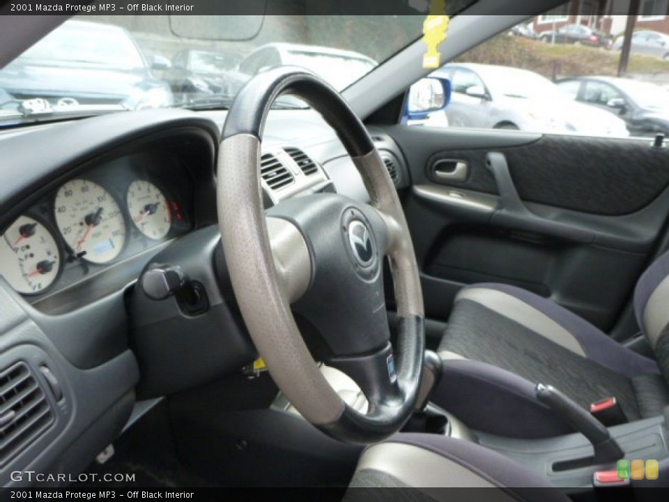 Off Black Interior Steering Wheel for the 2001 Mazda Protege MP3 #78783544