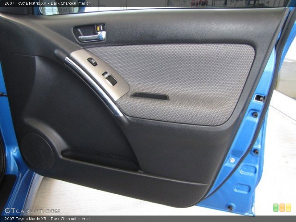 Dark Charcoal Interior Door Panel for the 2007 Toyota Matrix XR #78862431