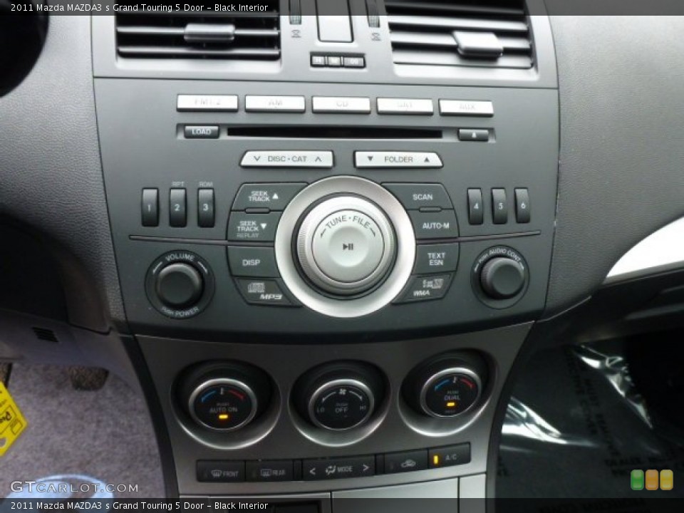 Black Interior Controls for the 2011 Mazda MAZDA3 s Grand Touring 5 Door #78909327