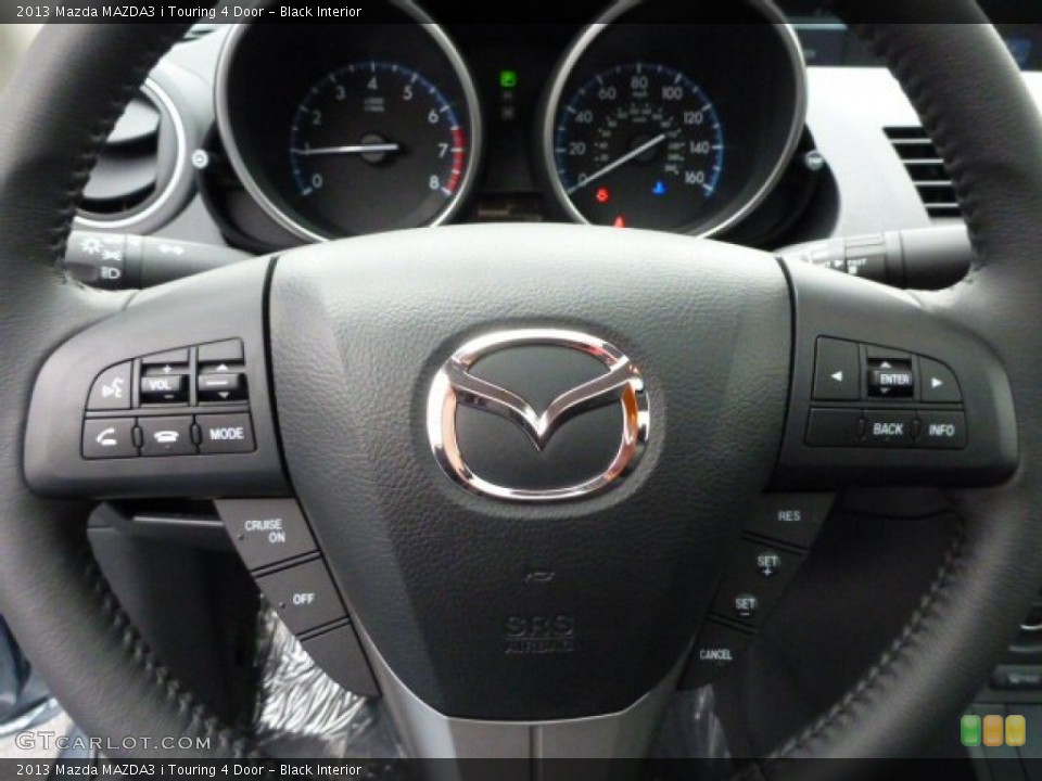 Black Interior Steering Wheel for the 2013 Mazda MAZDA3 i Touring 4 Door #78913593