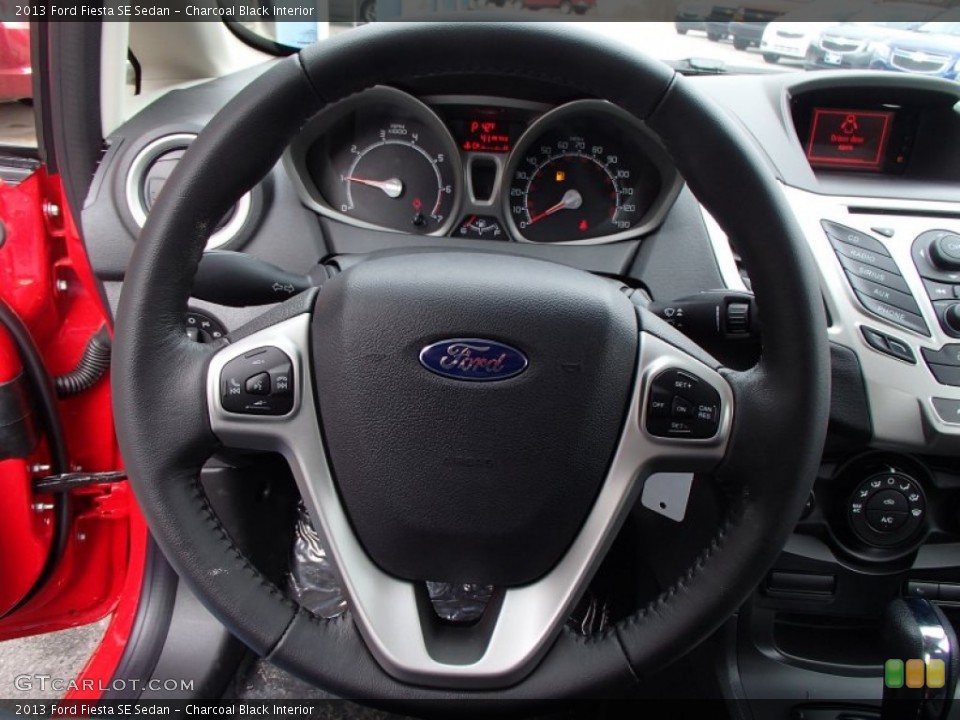 Charcoal Black Interior Steering Wheel for the 2013 Ford Fiesta SE Sedan #78991936